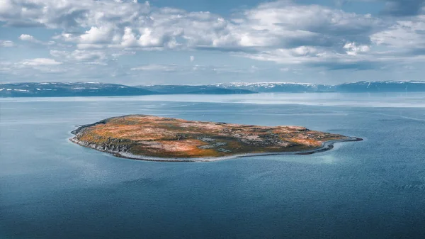 Cloudy coastline on a remote Norwegian island with serene ocean views.