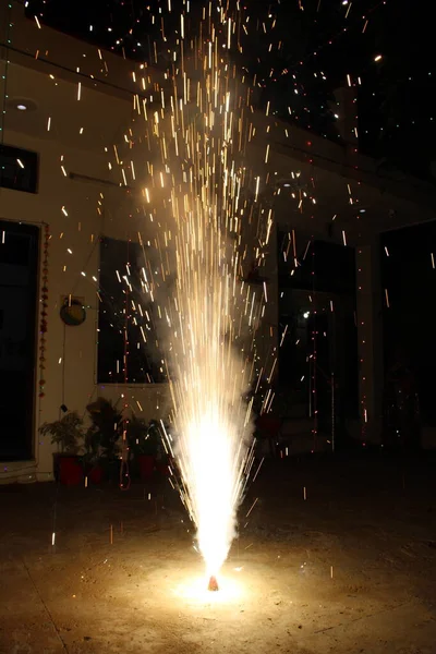 sparks with a torch in the night sky, lights, smoke, fire,