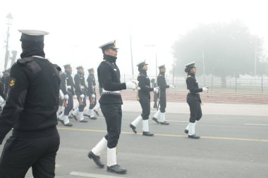 group of students in uniform walking in the city