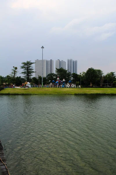 stock image Lake with cloudy sky meikarta apartment background