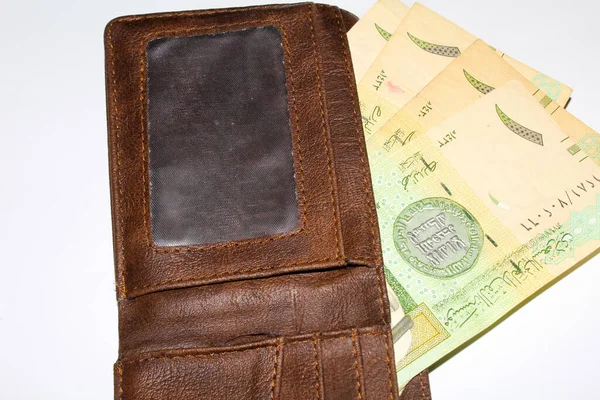 Man hand open the brown handmade leather empty wallet on white background  Stock Photo