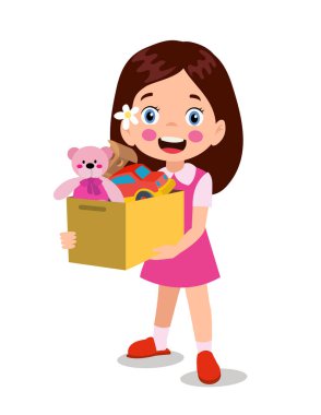 Oyuncak kutusundan oyuncaklarını alan tatlı çocuk.