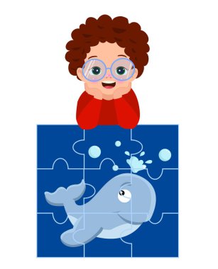 Mutlu küçük çocuk yap-boz oynuyor.