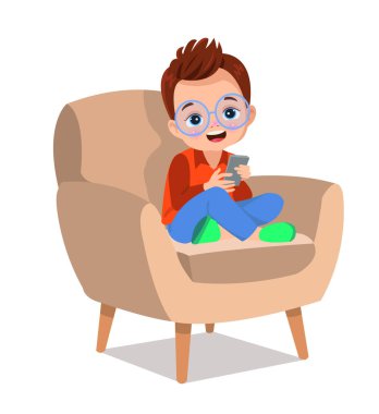 Çocuk bacak bacak üstüne atmış telefonla oynuyor.