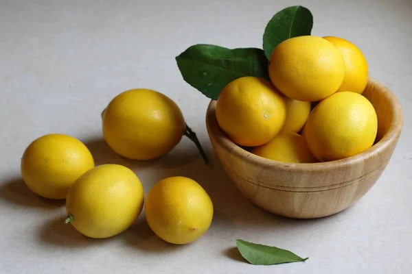 fresh yellow lemons on a white background