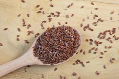 flaxseeds in a wooden spoon clipart