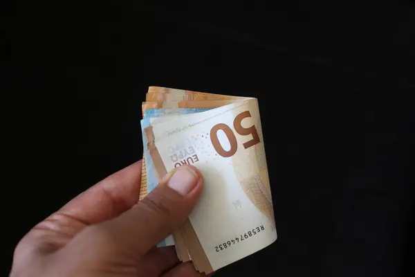 stock image hand holding money. European curreny