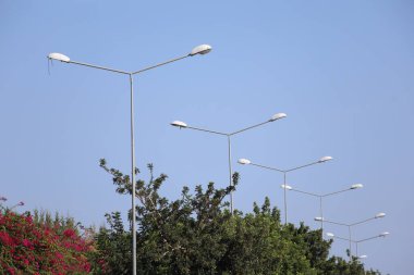 street lamp on blue sky clipart