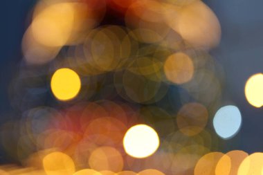 defocused christmas light bokeh in a christmas market clipart