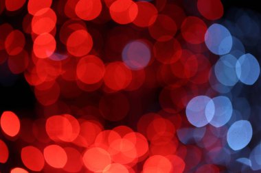 red defocused christmas light bokeh in a christmas market clipart