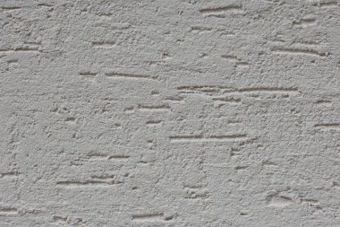 Duvarın dokusu, Son Giysi Dekoratif Alçısıyla sıvanmış. 