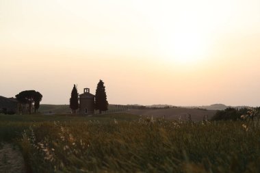Chapel of the Madonna di Vitaleta (capella madonna di vitalete) at sunset, Tuscany, Italy