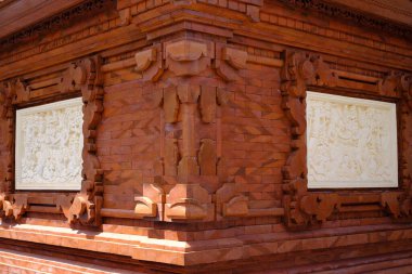 Traditional Balinese stone sculpture art and culture on a stone wall