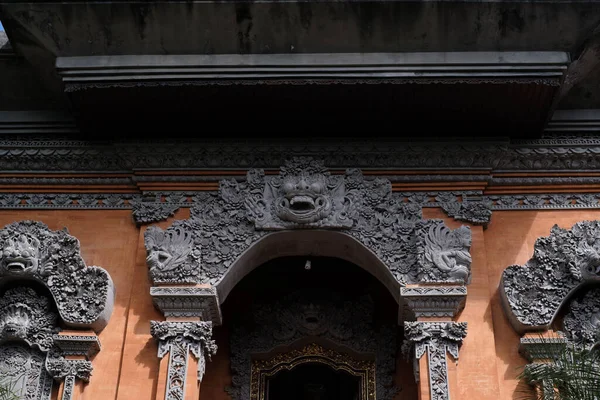 Traditional Balinese stone sculpture art and culture in a front gate or door