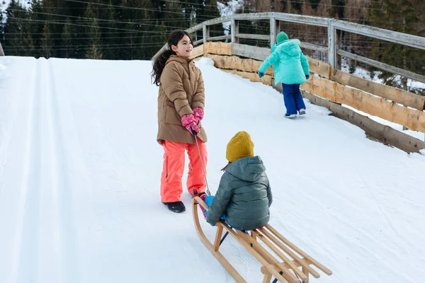 Three Kids Going Snow Slope Small Sister Wooden Sled — 图库照片