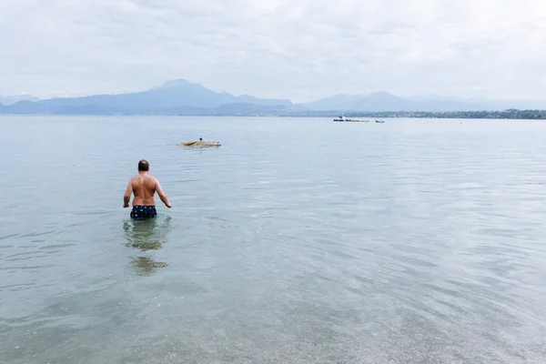 Rear View Man Entering Water Swim Lake Mountains Horizon — Stock Photo, Image