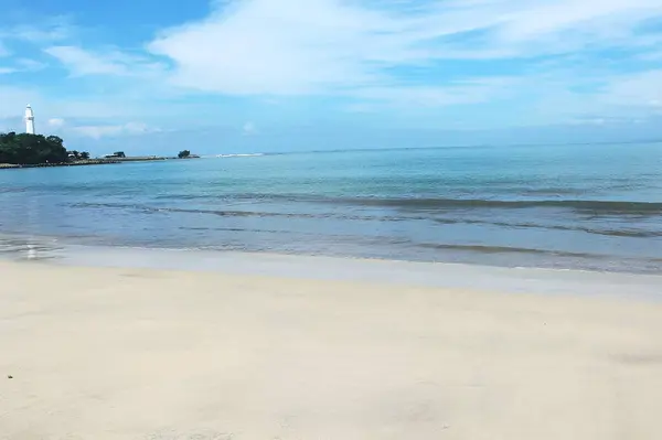 stock image blue sky at santolo beach in indonesia