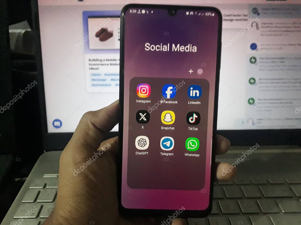 Hand holding smartphone with popular social media apps and Chat GPT on screen. Bangladesh - 26 Oct 2023