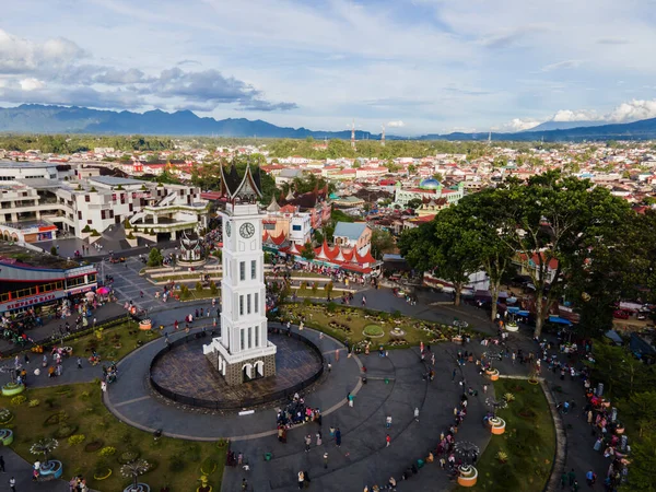 stock image Bukit Tinggi, Indonesia- 11-20-2021: Aerial view of Jam Gadang, a historical and most famous landmark in Bukit Tinggi City, an icon of the city and the most visited tourist destination by tourists.