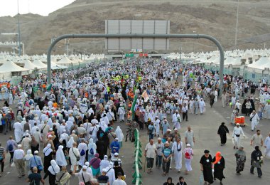 Muslim pilgrims walk outside Muaisem tunnel in Mina, Mecca, Saudi Arabia, to do jamarat ritual as part of hajj.  Millions of muslims around the world perform hajj during this time. clipart