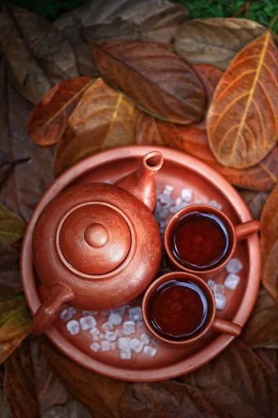 A pair of teacups and tea pot, made of clay with a traditional design. Drinking tea is a Javanese culture, Indonesia.