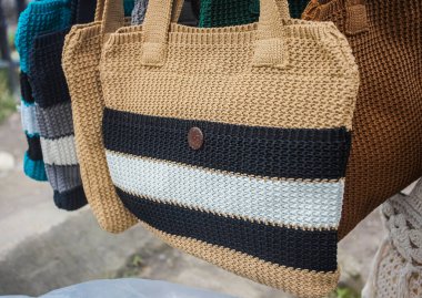 Handmade knitted bags produced by small home industries are souvenirs for tourists at the Mount Tangkuban Parahu tourist spot in Bandung, Indonesia. Sold in stalls around the crater.