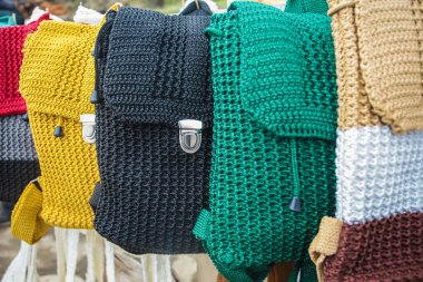 Handmade knitted bags produced by small home industries are souvenirs for tourists at the Mount Tangkuban Parahu tourist spot in Bandung, Indonesia. Sold in stalls around the crater.