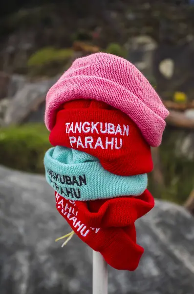 Handmade knitted beanie produced by small home industries are souvenirs for tourists at the Mount Tangkuban Parahu tourist spot in Bandung, Indonesia. Sold in stalls around the crater.