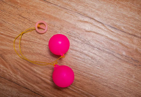 Selective focus photo of Lato-Lato, a traditional children's toy which is currently going viral, especially in Indonesia. Many children play this toy. 
