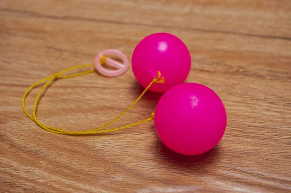 Selective focus photo of Lato-Lato, a traditional children's toy which is currently going viral, especially in Indonesia. Many children play this toy. 