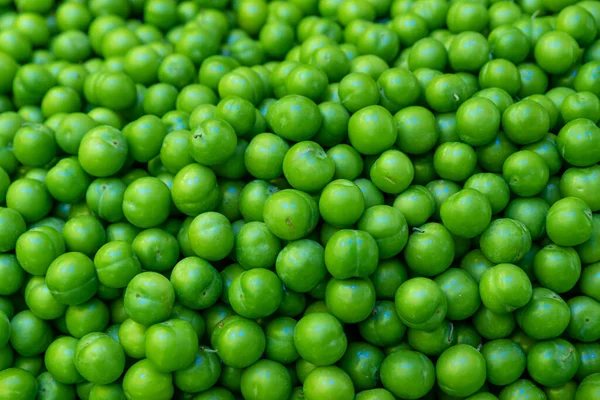 background from green plums , summer fruit green plum sold in open air market. High quality photo