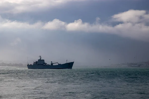 military ship cruising in istanbul marmara sea and cloudy weather , military ship standing alone. High quality photo