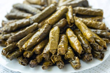 Traditional delicious Turkish foods , stuffed leaves ,traditional turkish dish made from rice wrapped in grape leaves. High quality photo