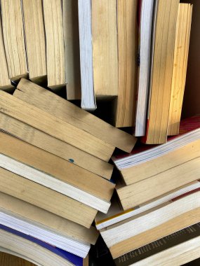 many books on wooden background.