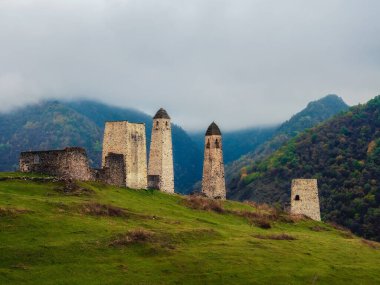 Majestic battle towers of Ingushetia. Historical monument, tourist attraction. Medieval tower complex Erzi, one of the largest medieval castle-type tower villages.