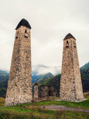 Majestic battle towers of Ingushetia. Historical monument, tourist attraction. Medieval tower complex Erzi, one of the largest medieval castle-type tower villages.
