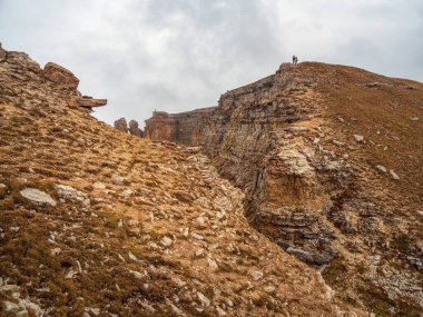 Loose red rocks. Mountain gorge. Desert mountains landscape.