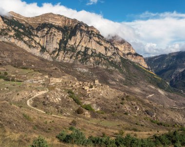 Abandoned ethnic aul. Old abandoned ghost town of Digoria region. The ancient city under the mountain. Excavations of the historical heritage of ancient history. North Ossetia, Russia. 