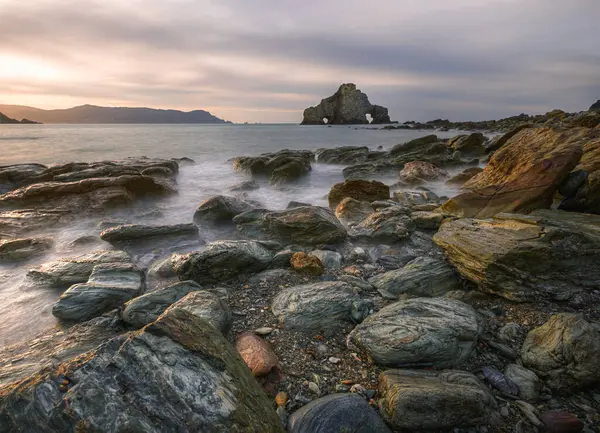 stock image The peculiar shape of the rock known as Penafurada or O Carro on the beach of o Sarridal in the cliffs of Loiba Espasante Galicia Galicia