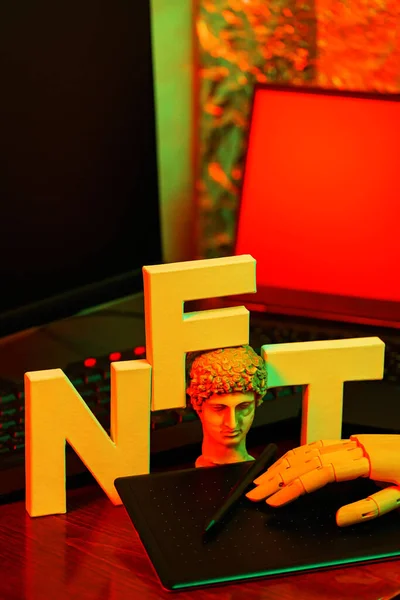 stock image Concept of NFT creation by artificial intelligence. NFT inscription with graphic tablet and artificial arm. Crypto Art