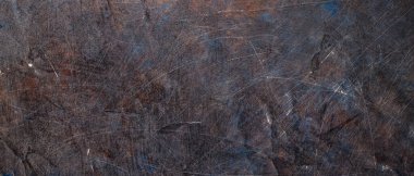 Çizik yüzeyin karanlık ve soyut arkaplanı. Rengi solmuş. Grunge yüzey vintage arkaplanı