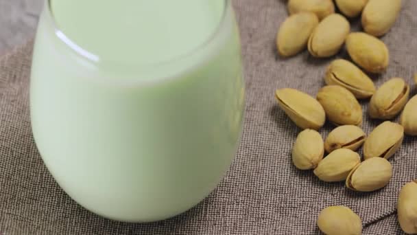 Pistachio Milk Glass Pistachionuts Gray Background Vegan Plant Based Milk — Stock video