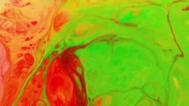Liquid paint mixing backdrop with splash and swirl. Abstract colored background footage. Fluid design