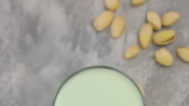 Pistachio Milk Glass Gray Concrete Background Organic Lactose Free Pistachio — Stock video