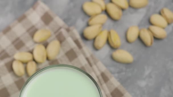 Pistachio Milk Glass Gray Concrete Background Organic Lactose Free Pistachio — Stock Video
