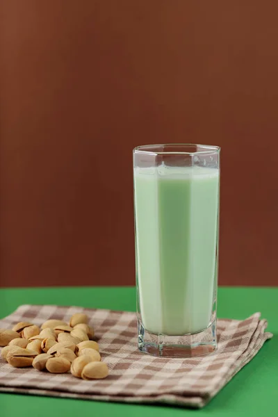 Healthy Pistachio Milk Green Brown Background Vegan Milk Made Pistachios — Stock Fotó
