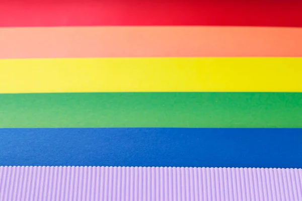 stock image Rainbow flag from stripes of multicolored paper, close up. LGBT Pride month concept