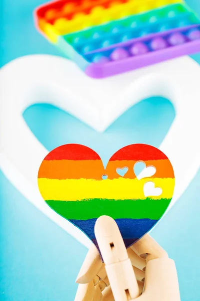 stock image Rainbow heart and white heart on blue background. LGBT equal rights movement and gender equality concept