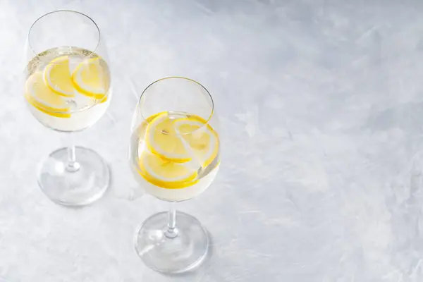 stock image Hugo Spritz Cocktail in Glass with Lemon on Gray Background, Summer Alcoholic Drink