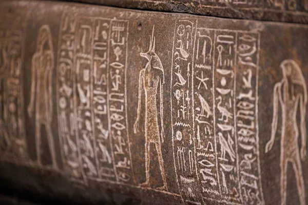 Ancient Egyptian hieroglyphs engraved in stone - Cairo.